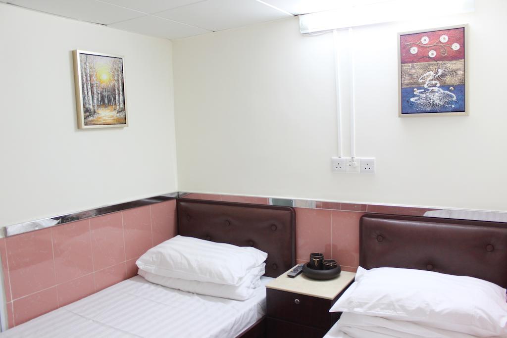 Hoi Shing House Hotell Kowloon  Rum bild